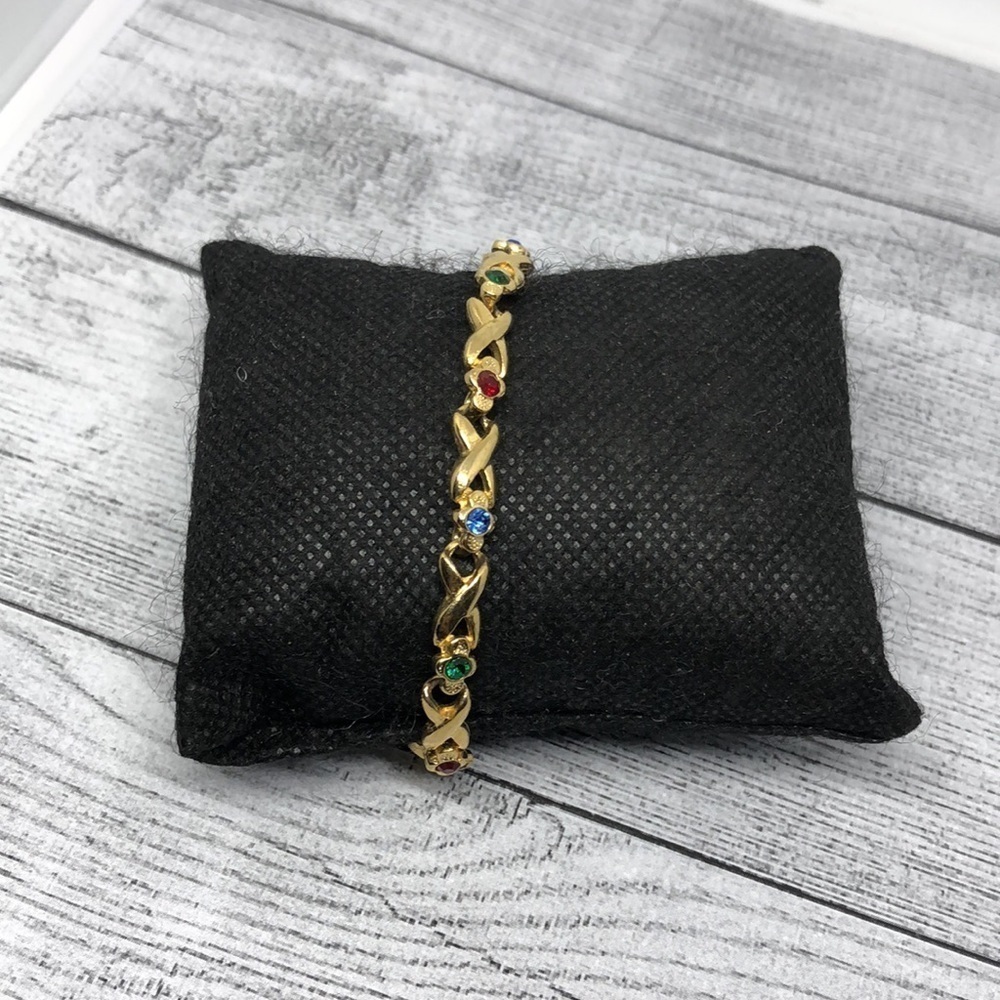 VINTAGE gold tone colorful bejweled faux gemstone costume tennis metal bracelet.